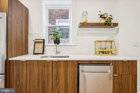 a kitchen with counter top space and refrigerator