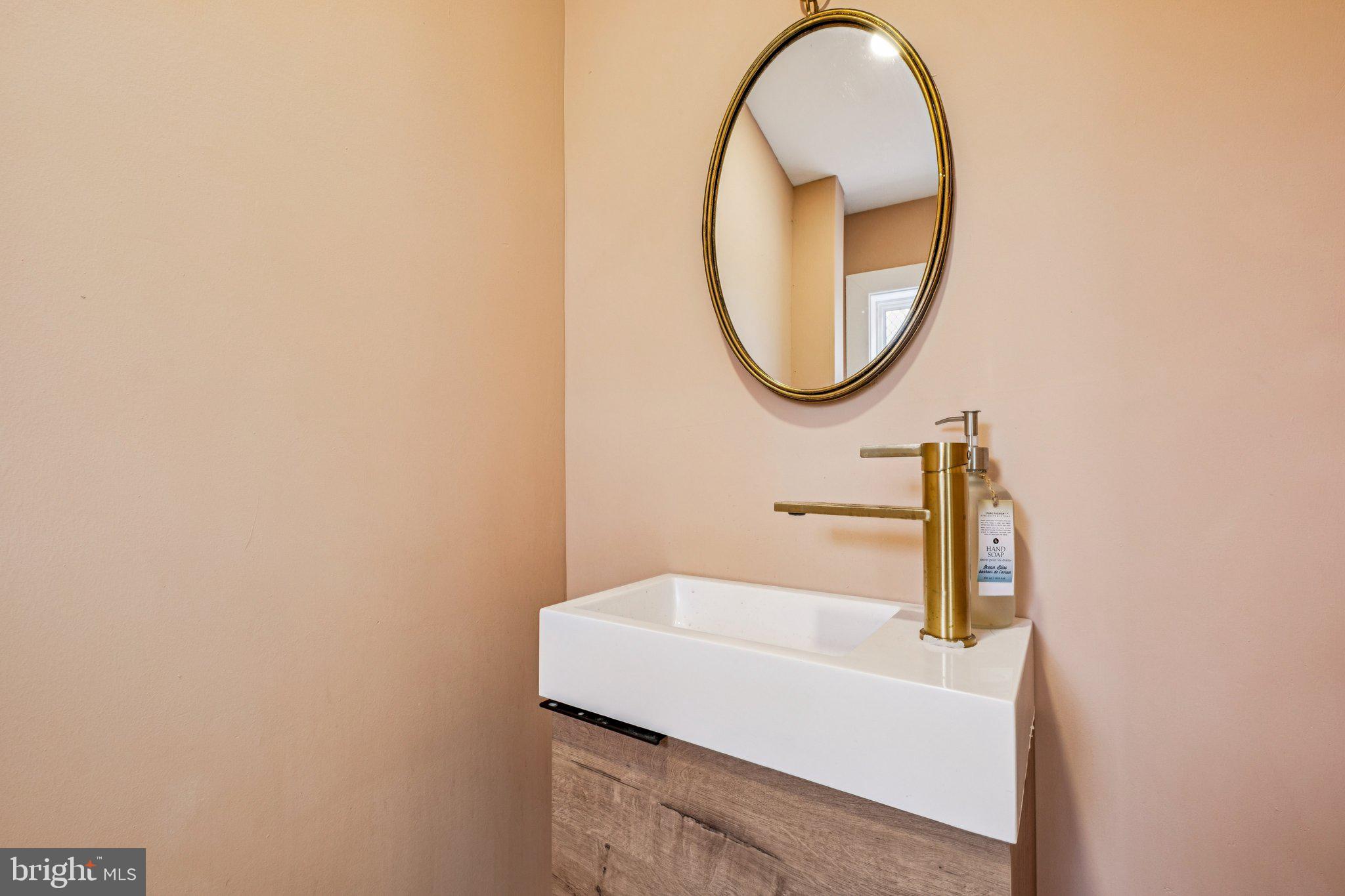 3010 Redner Street Philadelphia, PA 19121 - Photo 10 of 27 a bathroom with a sink and a mirror