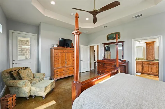 a bedroom with furniture and a window