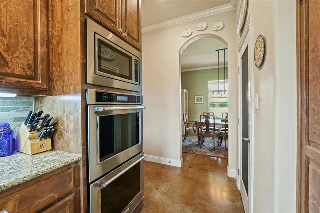a kitchen with a refrigerator and a sink