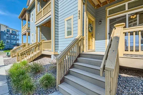 a view of a house with wooden stairs