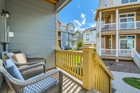 a view of a balcony with furniture