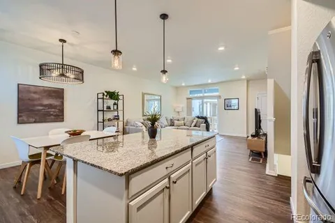 a kitchen with center island and stainless steel appliances
