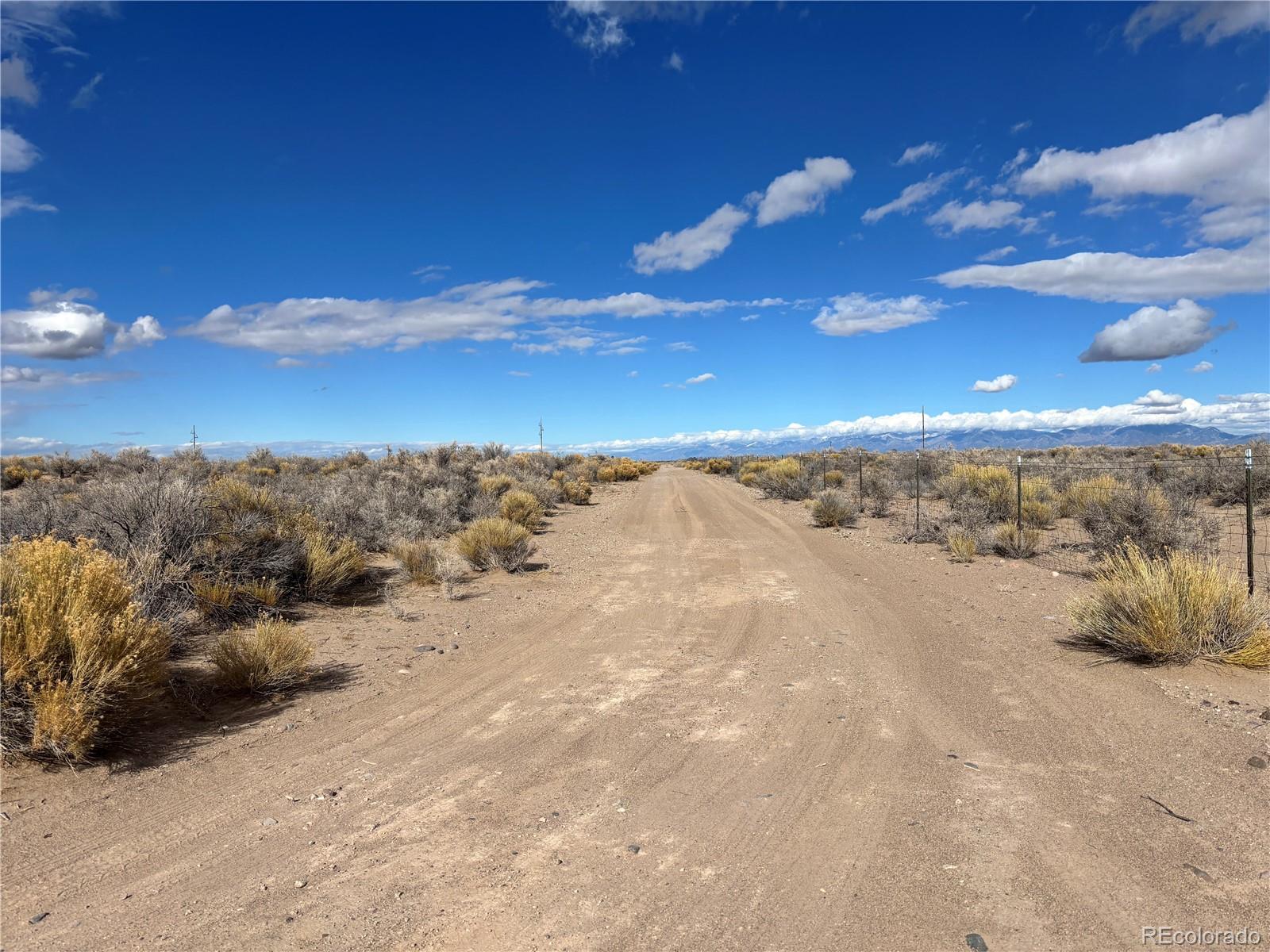 0 Clift Road Sanford, CO 81151 - Photo 4 of 12 a view of a road from a yard