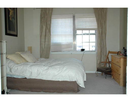 211 Lake Shore Road, Unit 3 Boston, MA 02135 - Photo 3 of 6 a bedroom with a bed and a window