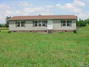 5690 Cherry Run Road Washington, NC 27889 - Photo 1 of 1 a front view of a house with a garden