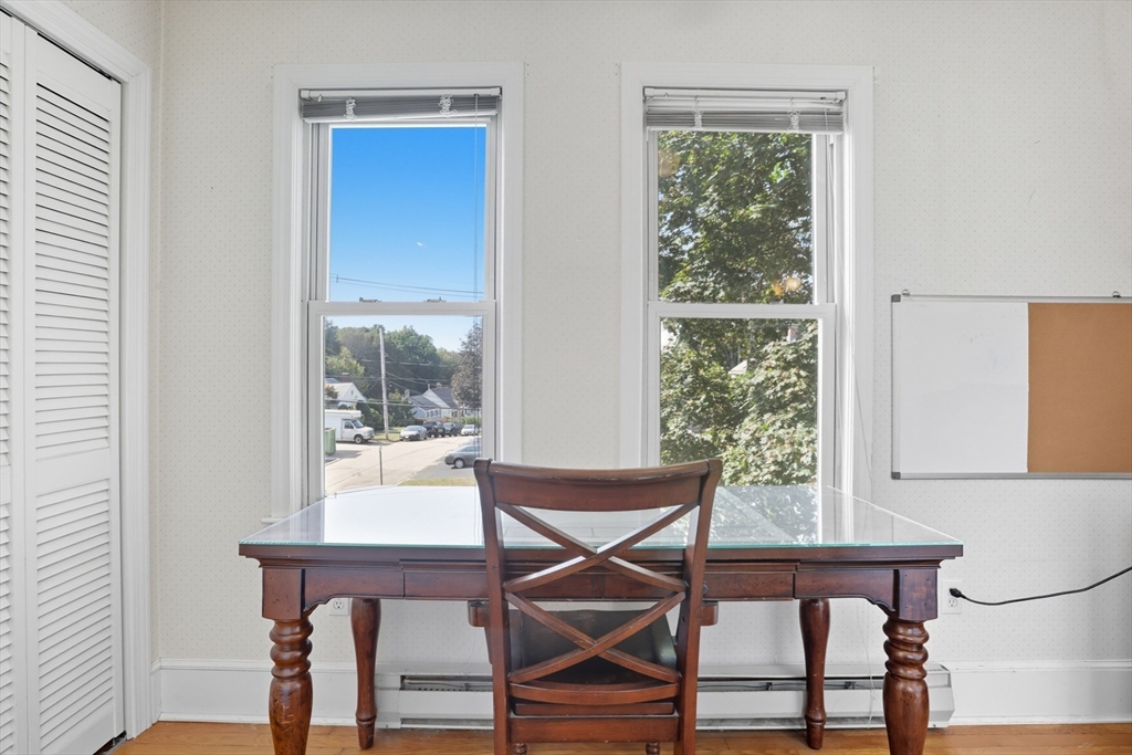 415-417 Washington Street Winchester, MA 01890 - Photo 17 of 41 a work room with wooden floor and windows