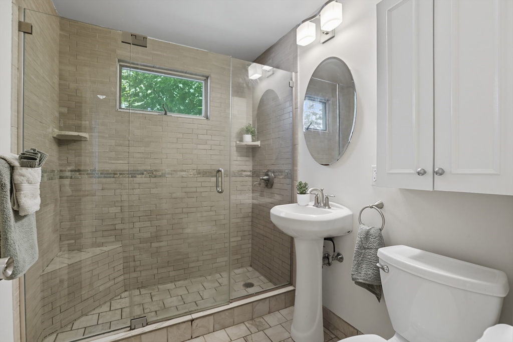 415-417 Washington Street Winchester, MA 01890 - Photo 18 of 41 a bathroom with a sink mirror and toilet