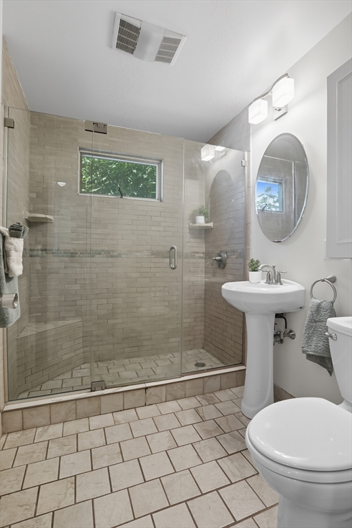 415-417 Washington Street Winchester, MA 01890 - Photo 19 of 41 a bathroom with a sink toilet and shower