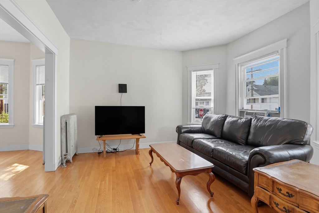 415-417 Washington Street Winchester, MA 01890 - Photo 32 of 41 a living room with furniture and a flat screen tv