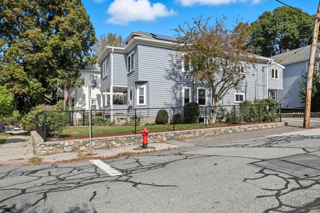 415-417 Washington Street Winchester, MA 01890 - Photo 40 of 41 a front view of a house with a yard