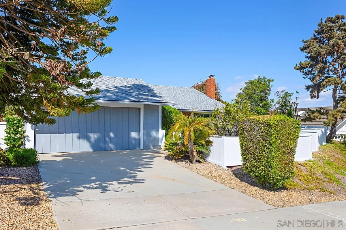 4520 Trieste Drive Carlsbad, CA 92010 - Photo 2 of 27 a front view of a house with a yard
