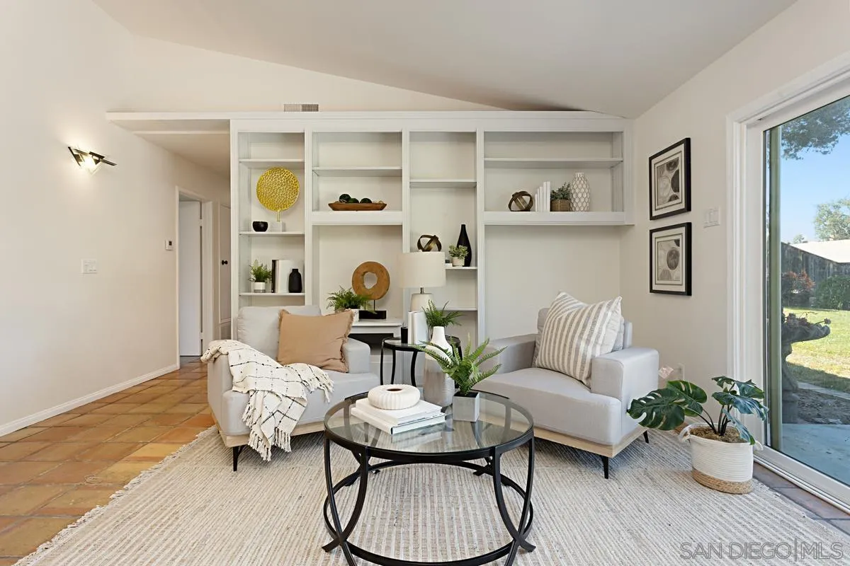 4520 Trieste Drive Carlsbad, CA 92010 - Photo 9 of 27 a living room with furniture and wooden floor