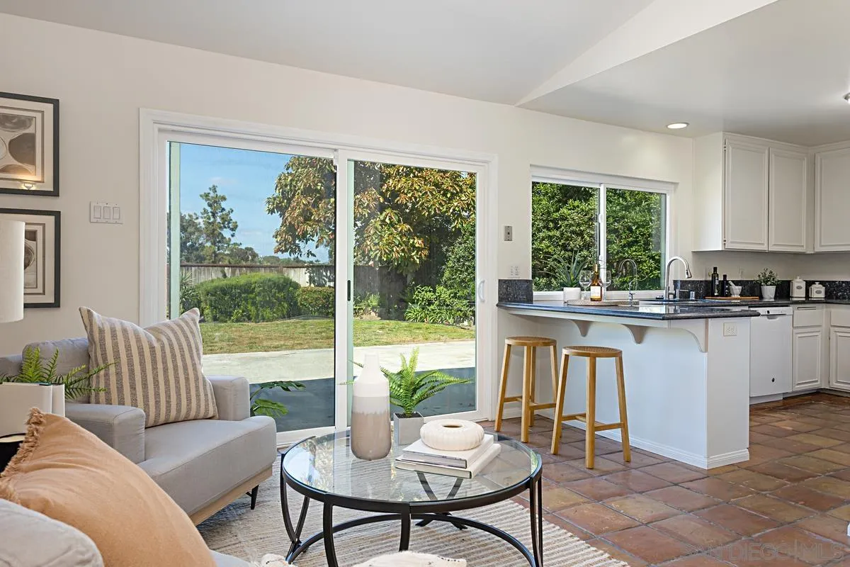 4520 Trieste Drive Carlsbad, CA 92010 - Photo 10 of 27 a living room with furniture and a large window