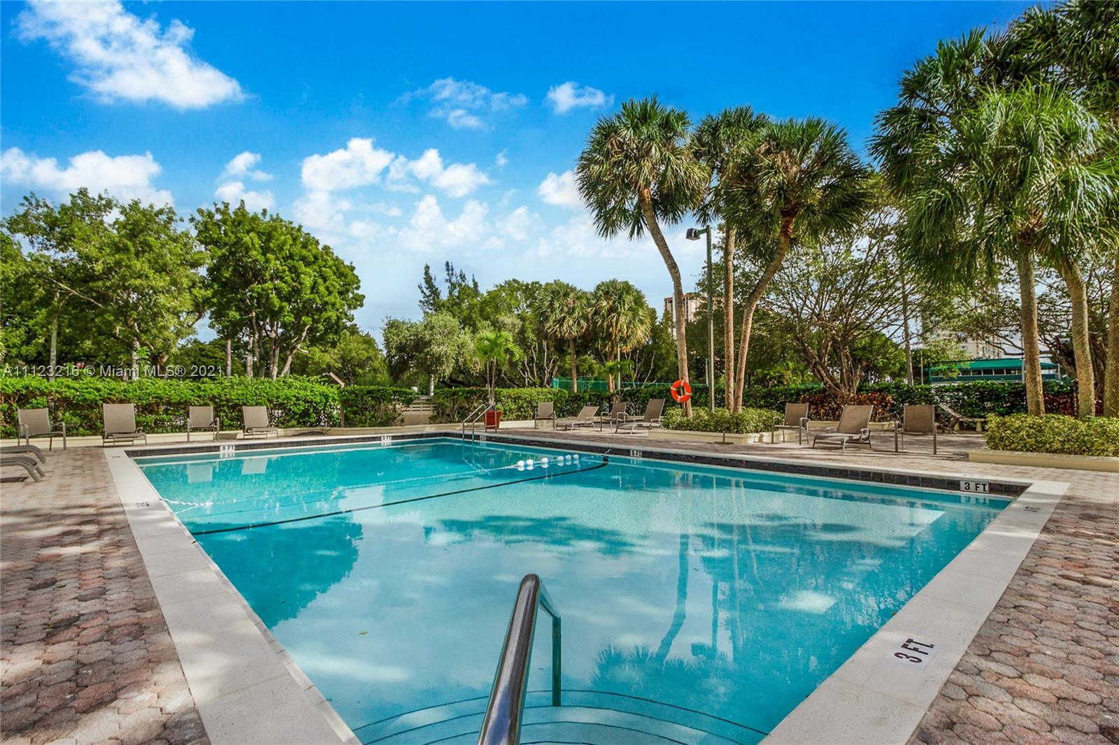 11111 Biscayne Boulevard, Unit 7C Miami, FL 33181 - Photo 16 of 18 a view of a swimming pool with a patio