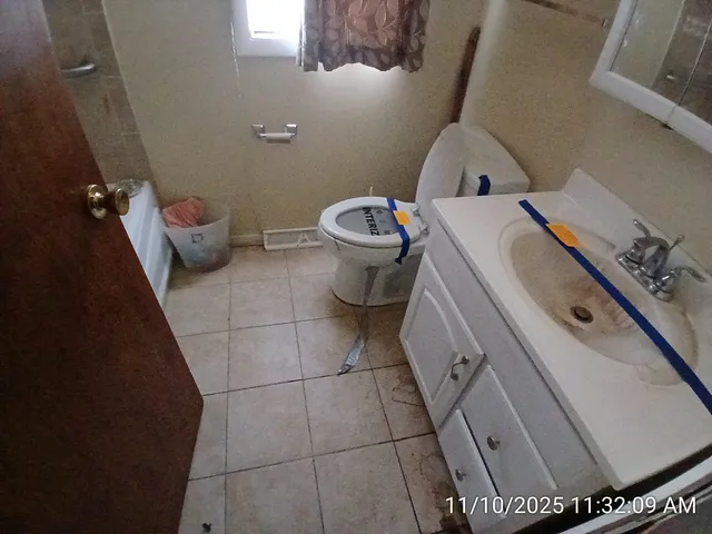 a bathroom with a sink and toilet