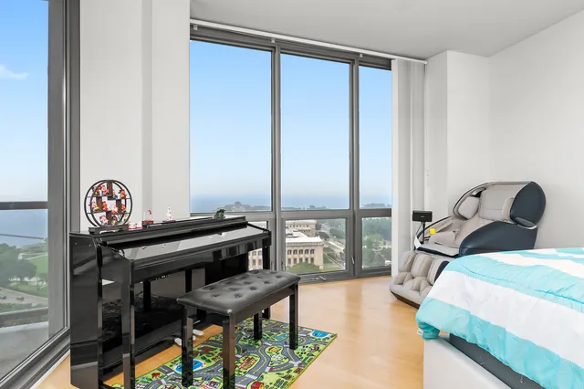 a bedroom with furniture and a window