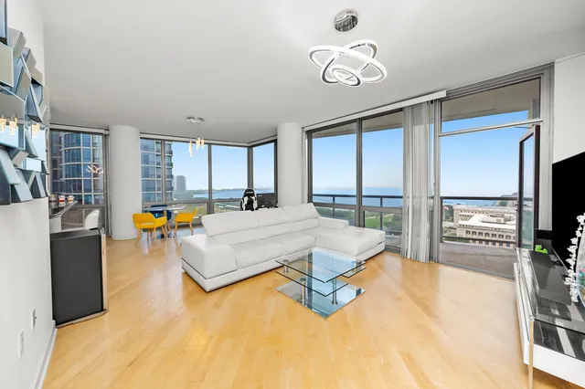 a living room with a flat screen tv and a table