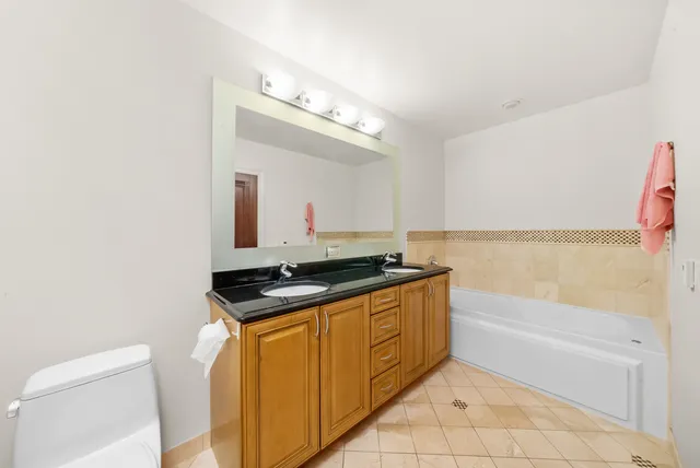a bath room with a sink and a mirror