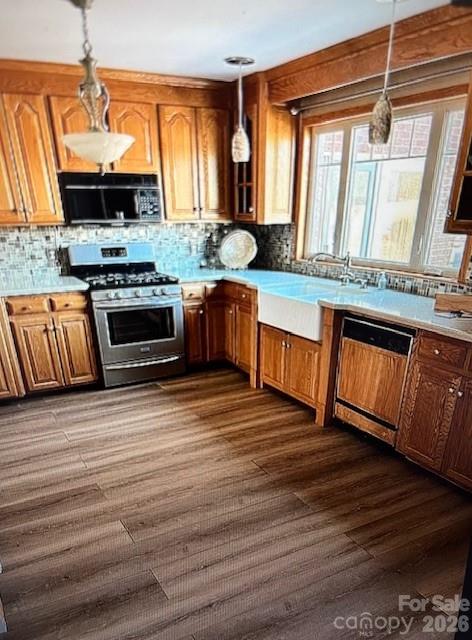 40659 Ridenhour Road Richfield, NC 28137 - Photo 11 of 24 a kitchen with stainless steel appliances granite countertop a stove a sink and a microwave
