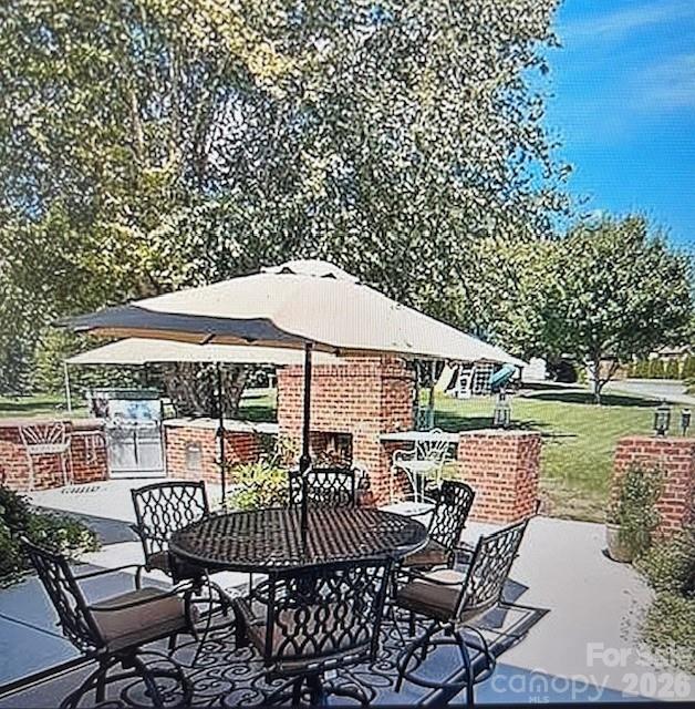 40659 Ridenhour Road Richfield, NC 28137 - Photo 21 of 24 a patio with glass top table and chairs