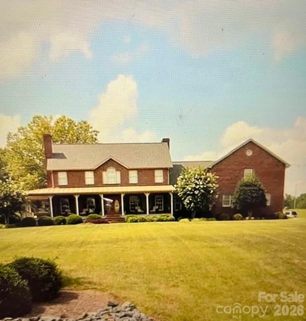 40659 Ridenhour Road Richfield, NC 28137 - Photo 4 of 24 a front view of a house with a yard