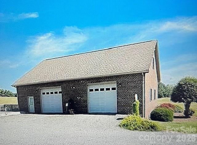 40659 Ridenhour Road Richfield, NC 28137 - Photo 6 of 24 a front view of a house with a garage