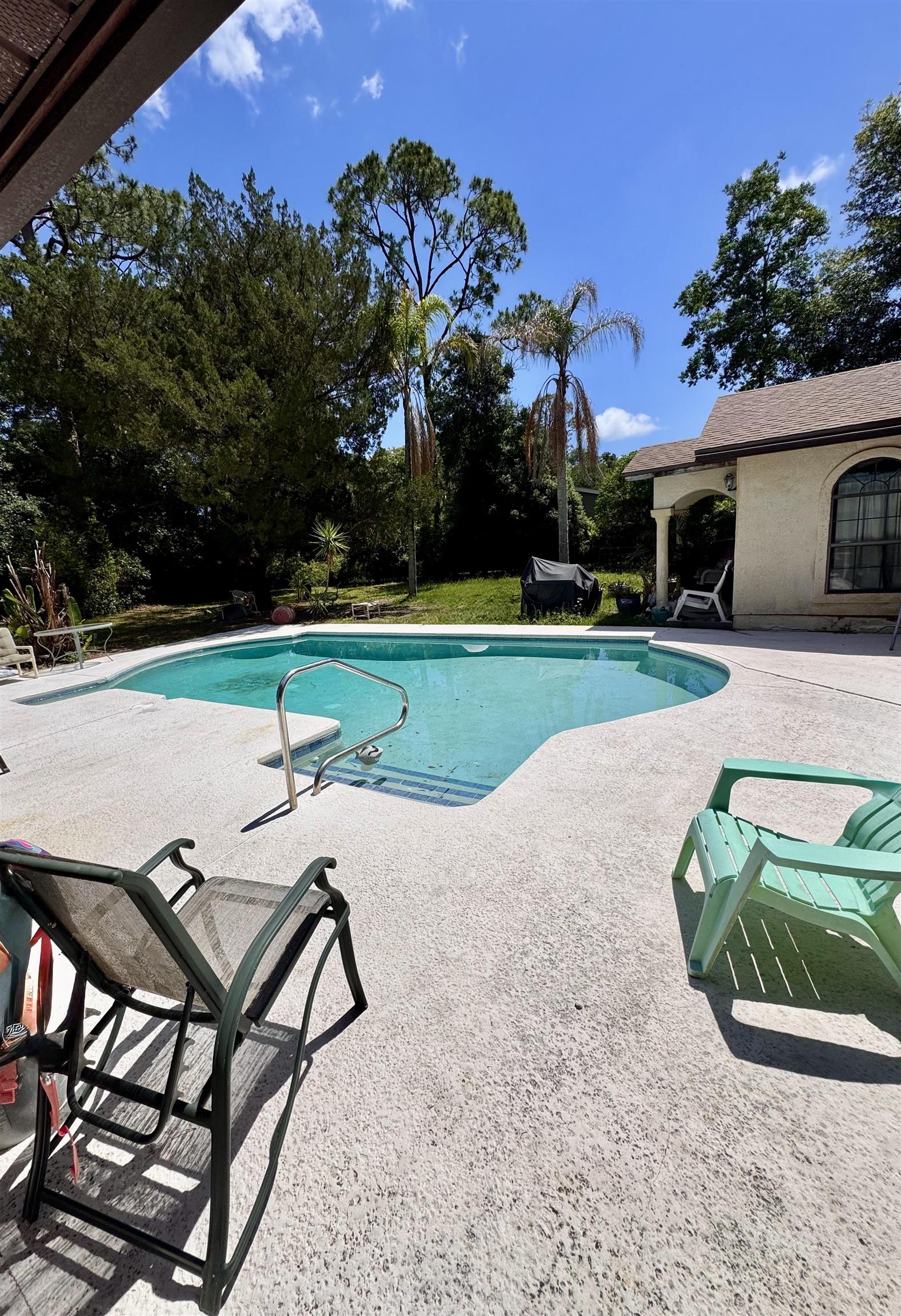 554 Hayley Road St. Augustine, FL 32086 - Photo 37 of 46 a view of a backyard with a garden and entertaining space