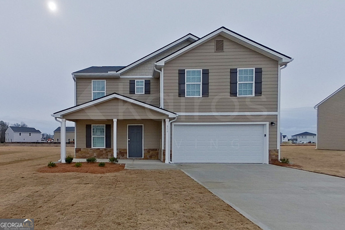 a front view of a house with yard