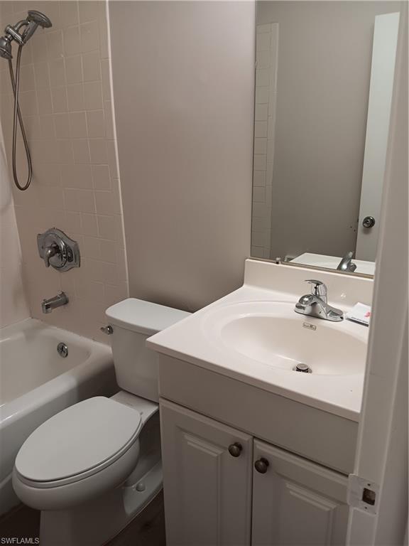 3325 Airport Road North, Unit H7 Naples, FL 34105 - Photo 12 of 15 a bathroom with a sink a toilet and shower