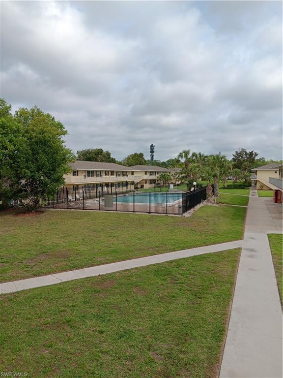 3325 Airport Road North, Unit H7 Naples, FL 34105 - Photo 15 of 15 a view of a big building with a big yard