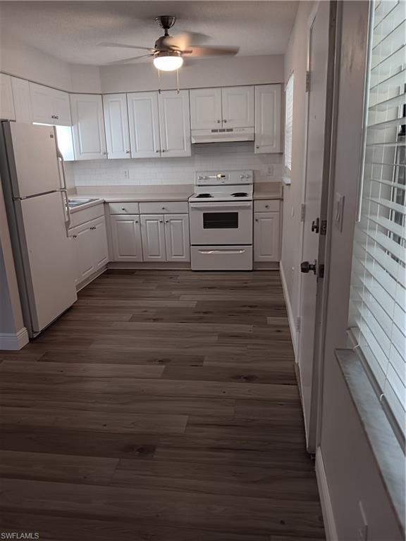 3325 Airport Road North, Unit H7 Naples, FL 34105 - Photo 4 of 15 a kitchen with cabinets appliances and a counter space