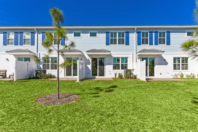 a view of a house with a yard porch and sitting area