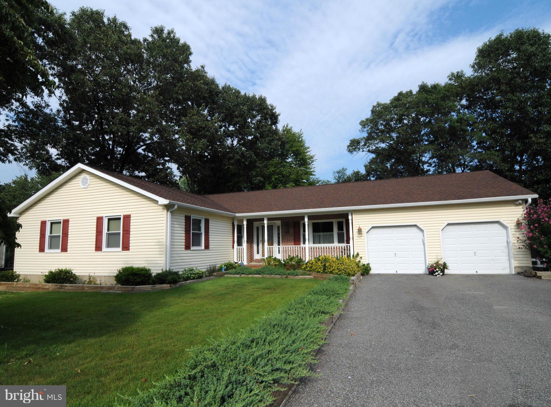 7881 Walnut Grove Road Severn, MD 21144 - Photo 1 of 21 a front view of a house with a garden