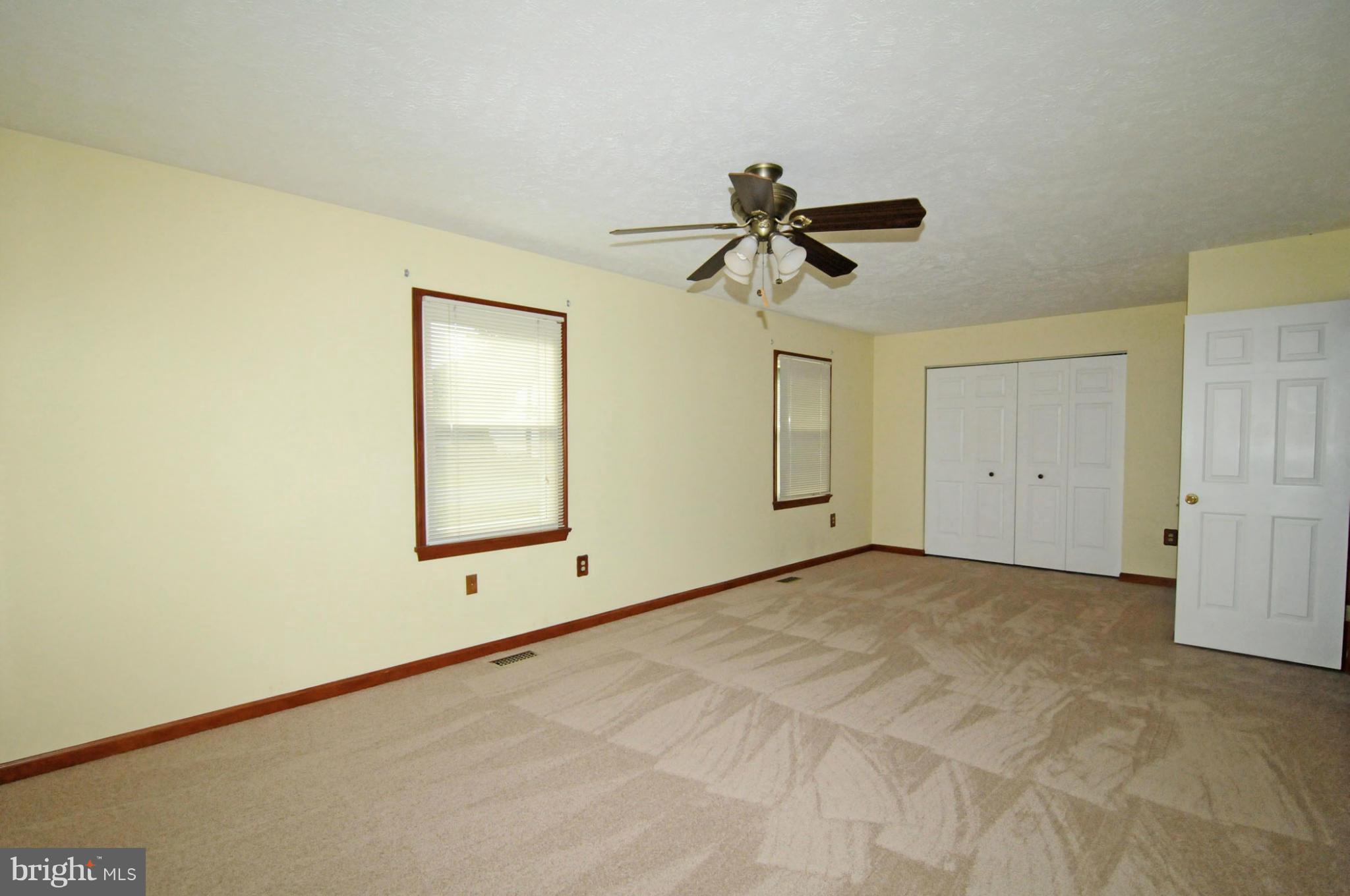7881 Walnut Grove Road Severn, MD 21144 - Photo 10 of 21 a view of room with a ceiling fan and window
