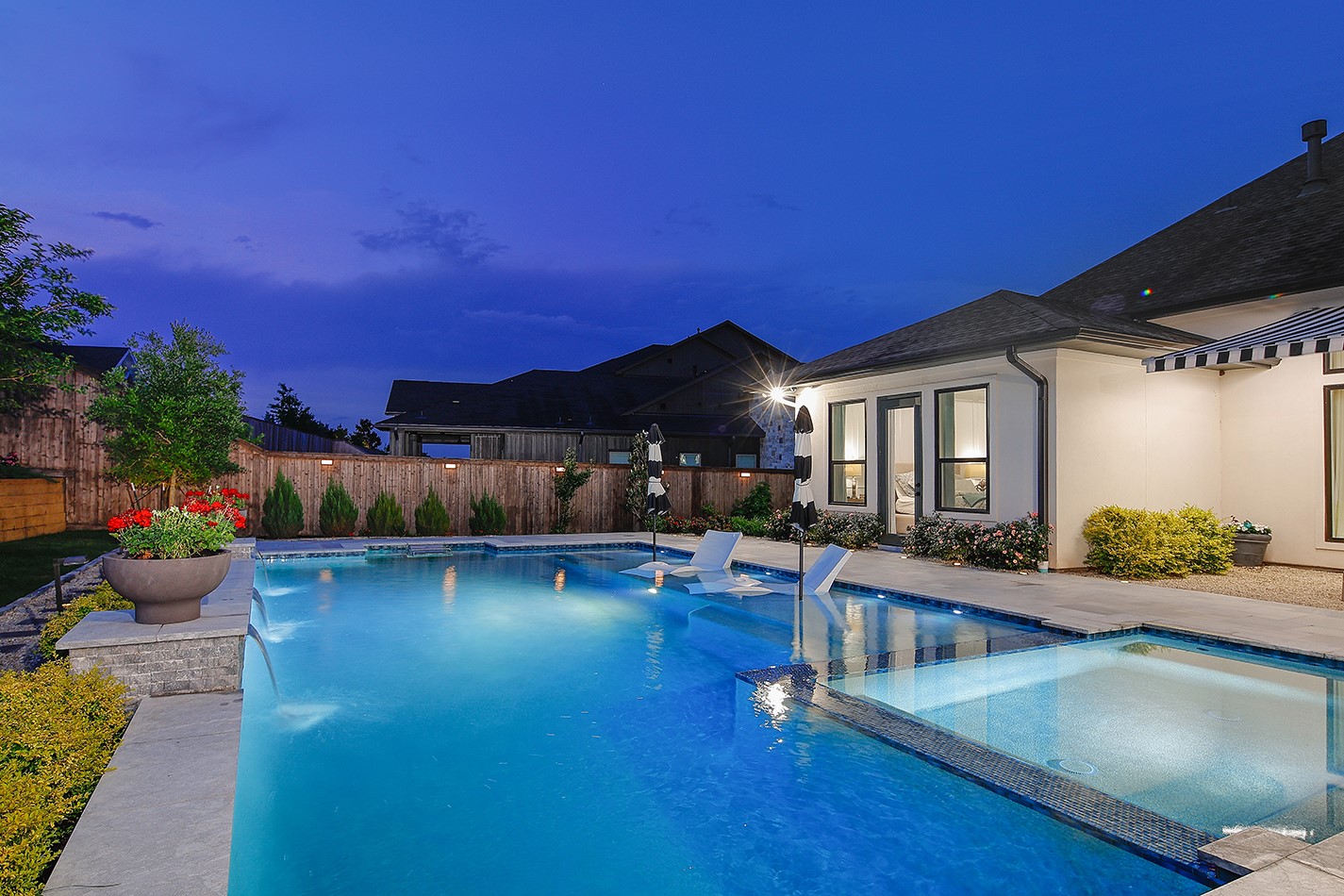 2017 Bennet Lane Conroe, TX 77384 - Photo 4 of 48 Resort-inspired outdoor living with vibrant gardens, exceptional entertaining spaces, and the privacy to enjoy every season