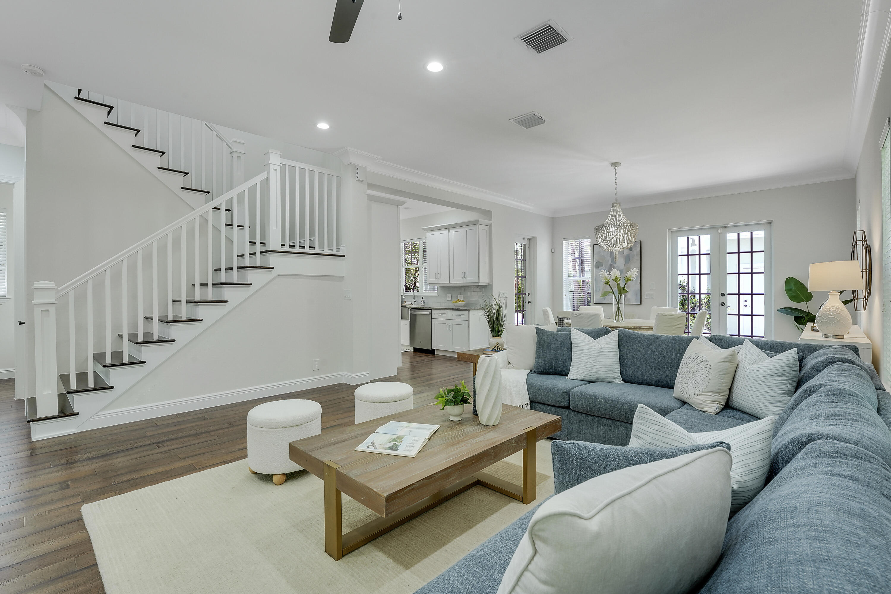 112 Spikerush Road Jupiter, FL 33458 - Photo 12 of 49 a living room with furniture and a wooden floor