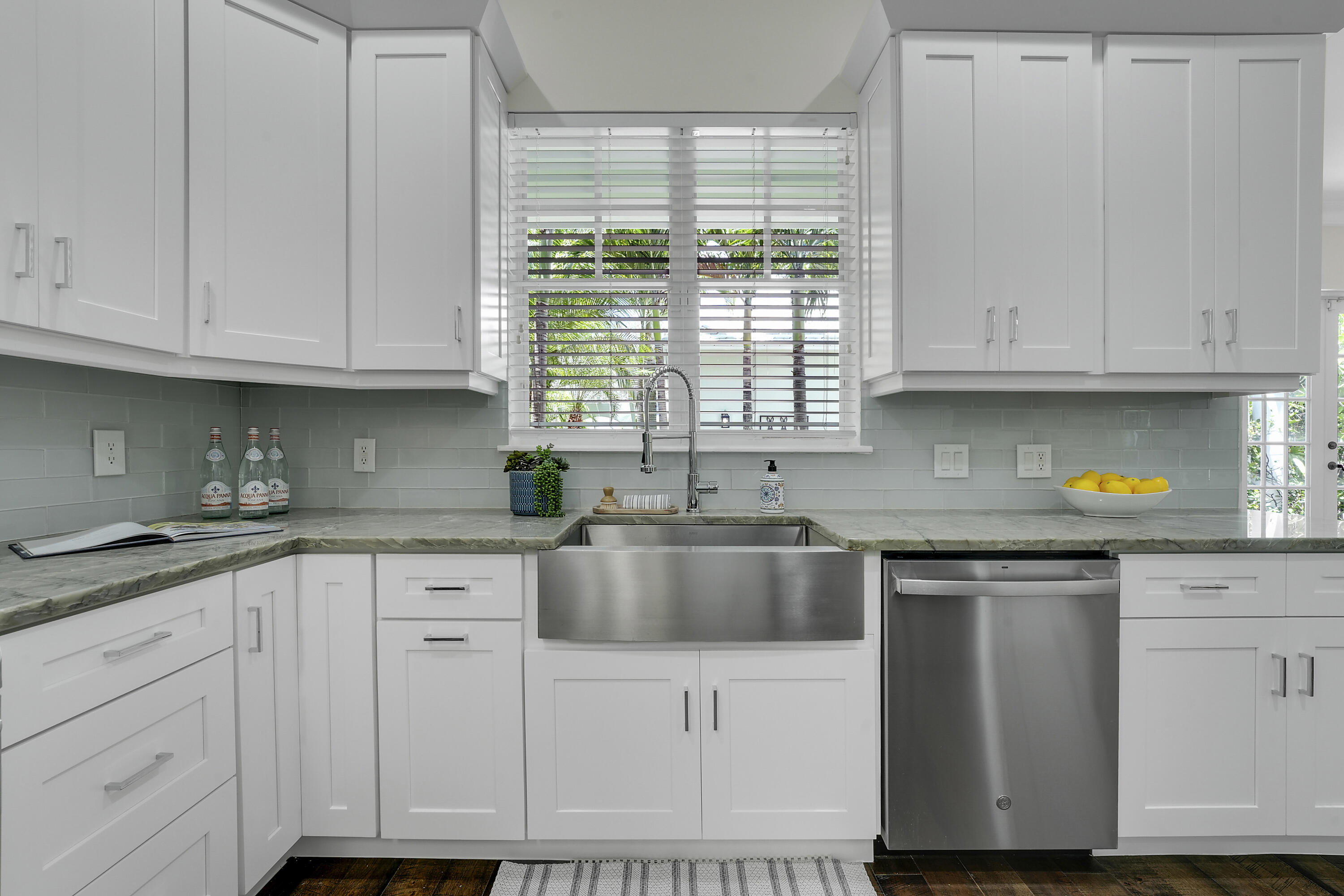 112 Spikerush Road Jupiter, FL 33458 - Photo 14 of 49 a kitchen with granite countertop white cabinets and a sink