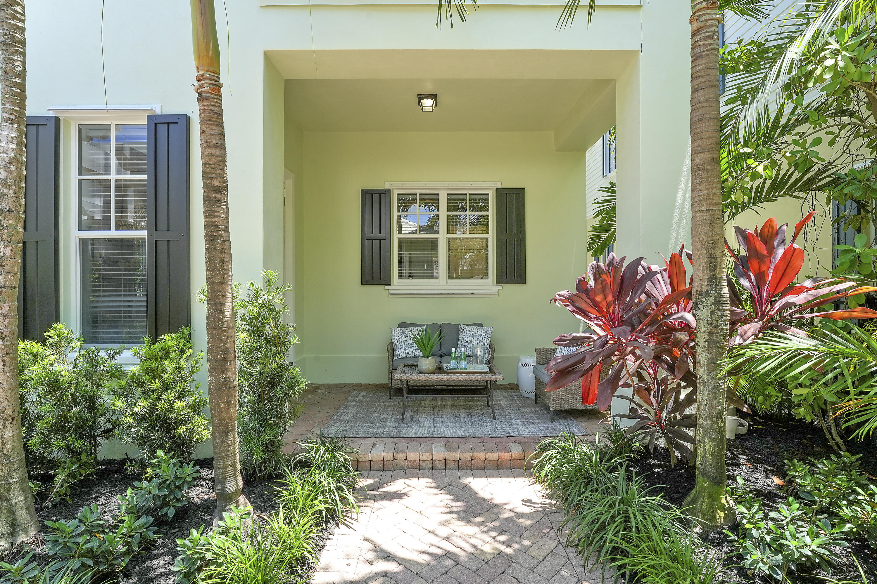 112 Spikerush Road Jupiter, FL 33458 - Photo 15 of 49 a front view of a house with a yard