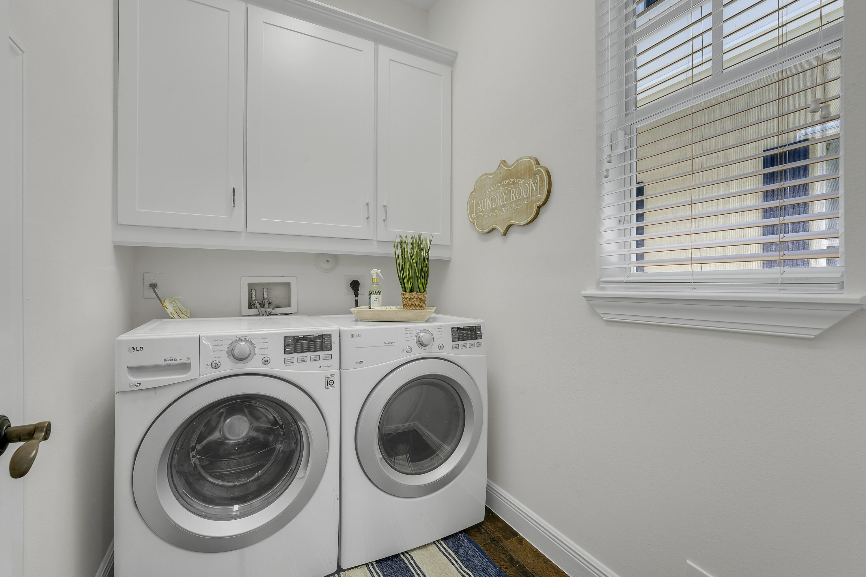 112 Spikerush Road Jupiter, FL 33458 - Photo 19 of 49 a utility room with dryer and washer