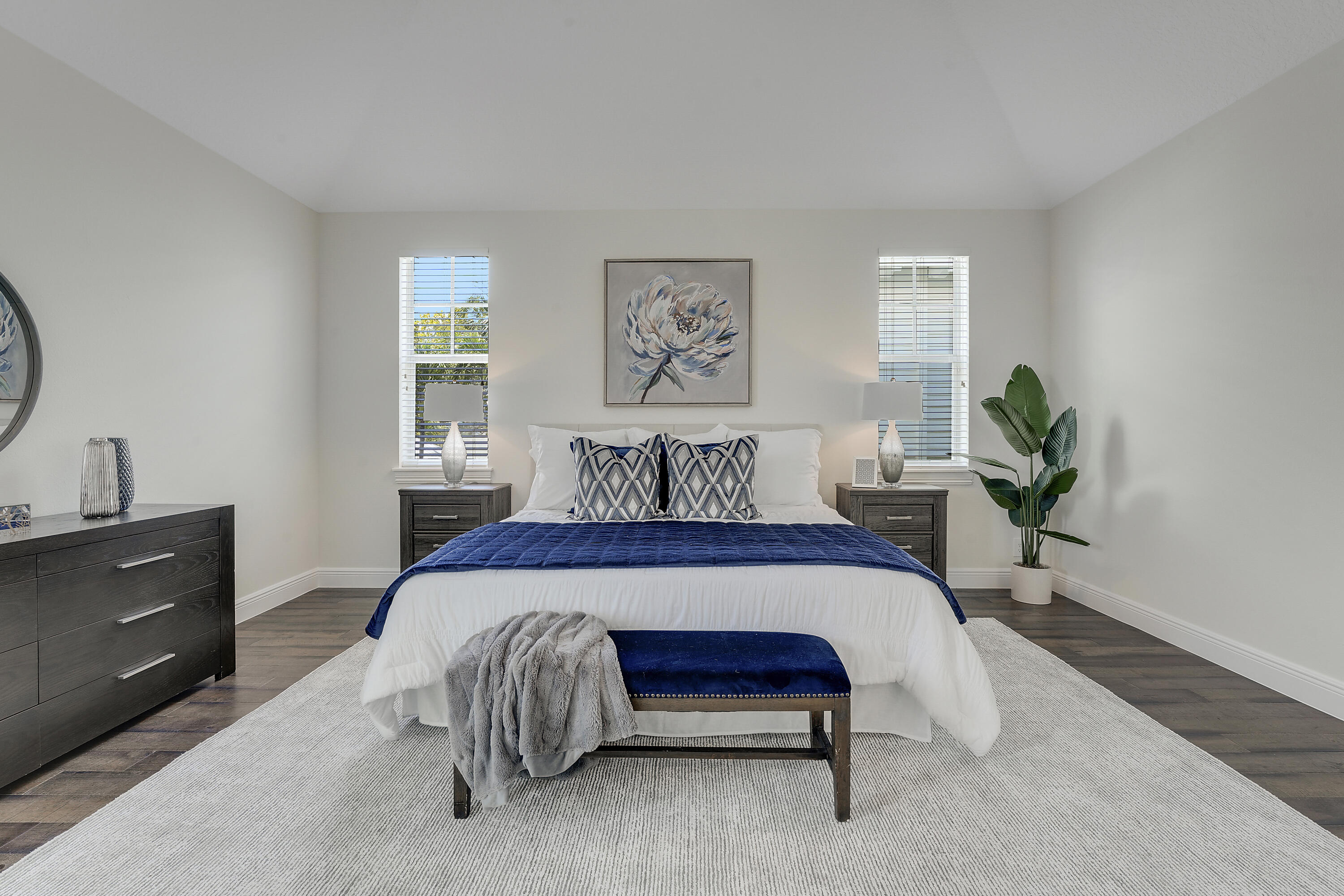 112 Spikerush Road Jupiter, FL 33458 - Photo 24 of 49 a bedroom with a bed and a dresser