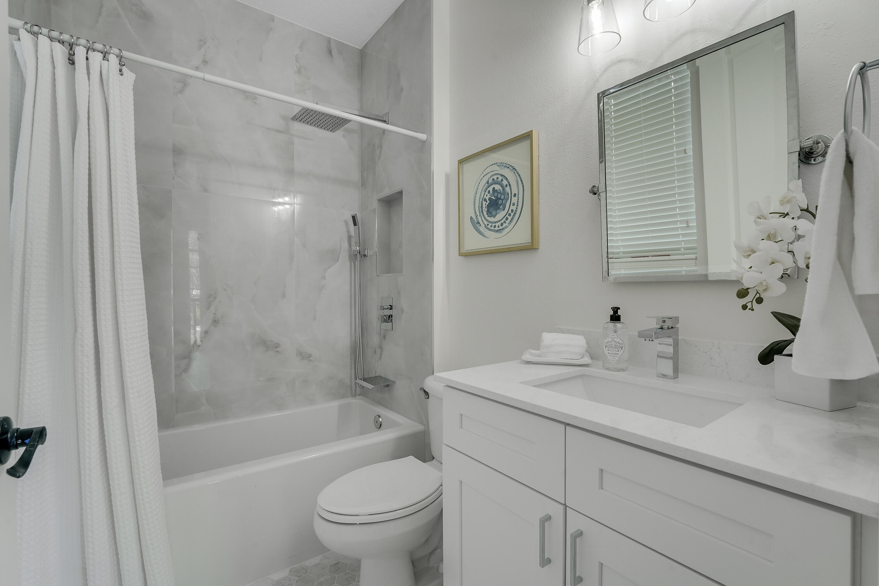 112 Spikerush Road Jupiter, FL 33458 - Photo 37 of 49 a bathroom with a sink toilet and shower