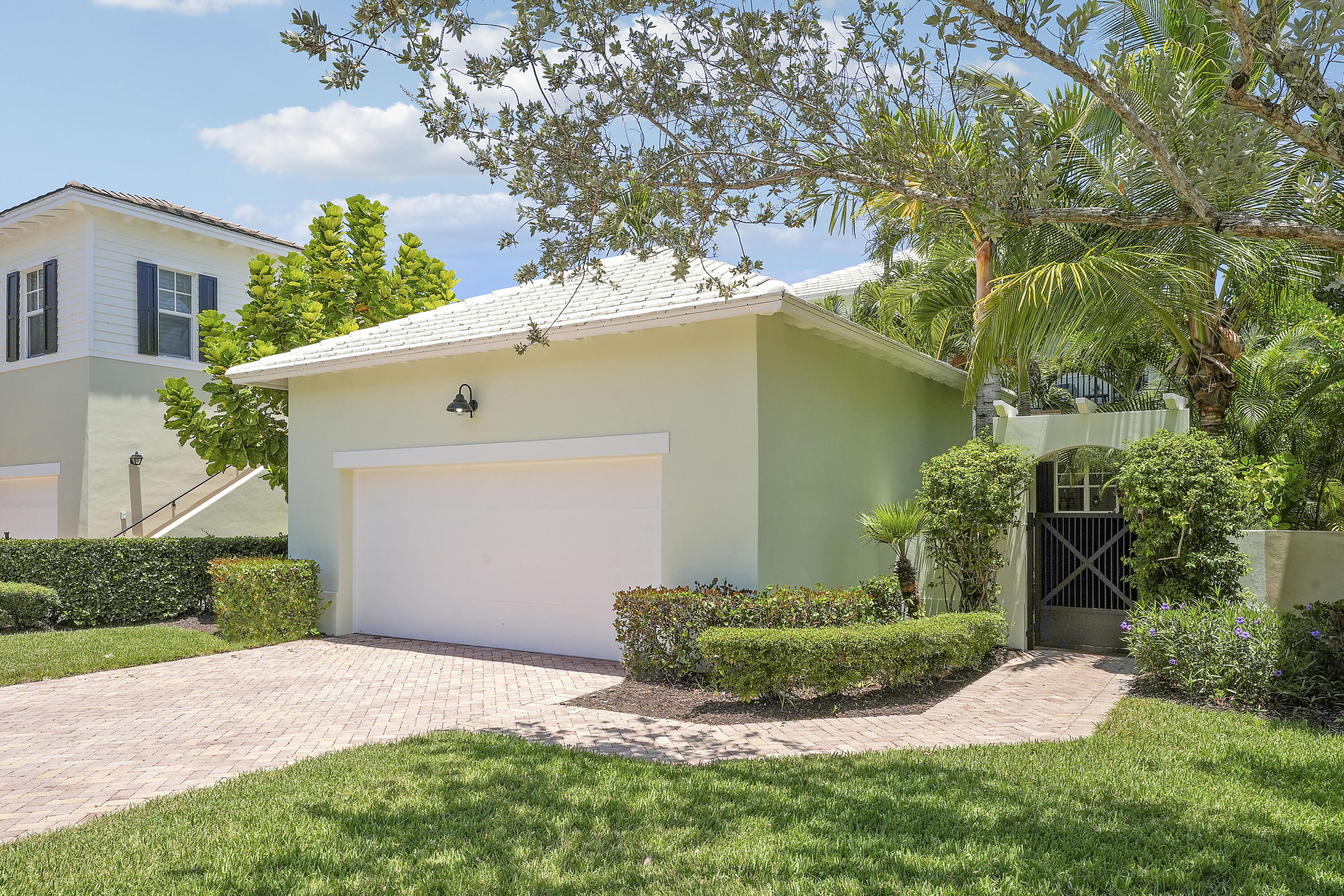 112 Spikerush Road Jupiter, FL 33458 - Photo 38 of 49 a front view of a house with a yard