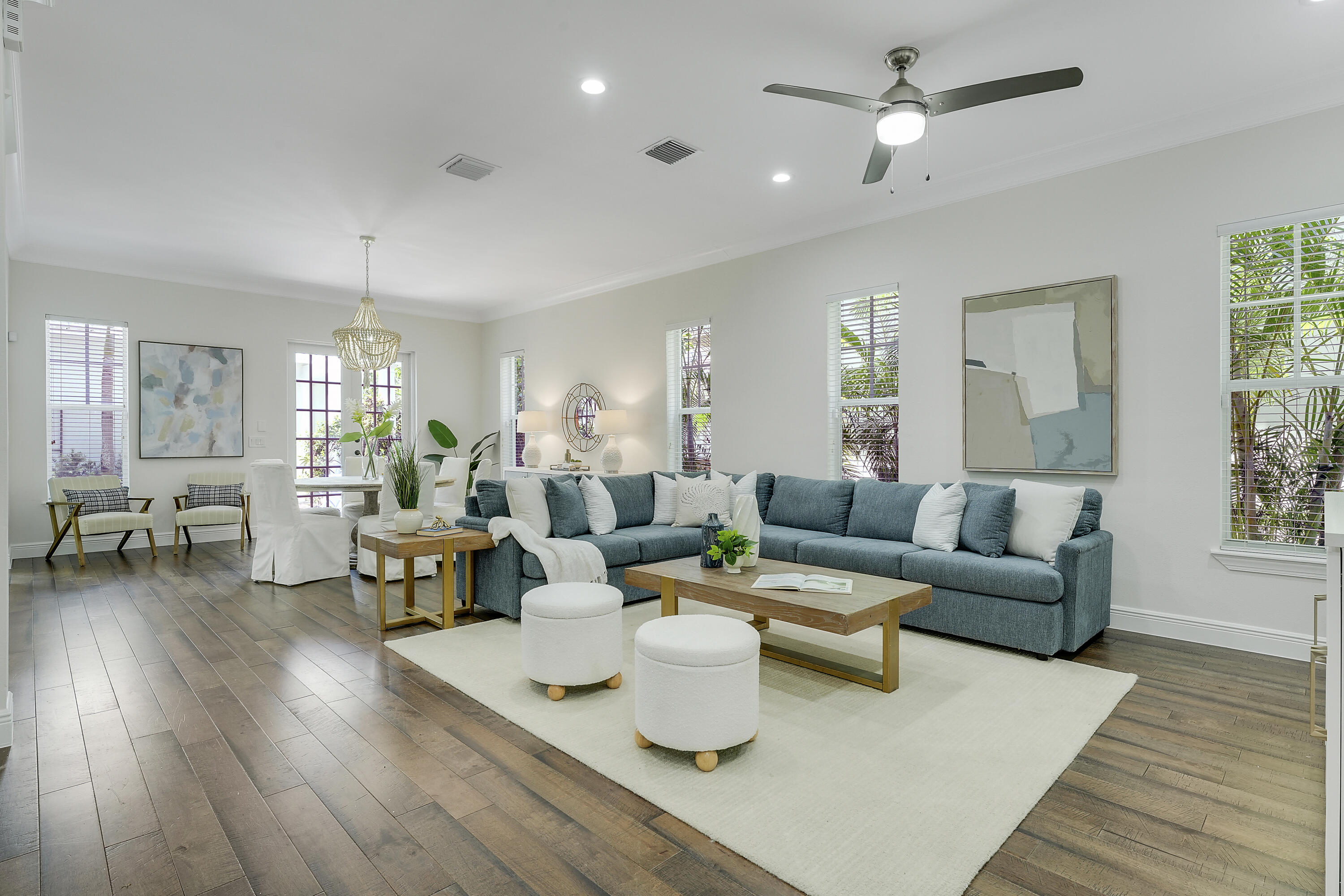 112 Spikerush Road Jupiter, FL 33458 - Photo 8 of 49 a living room with furniture and wooden floor