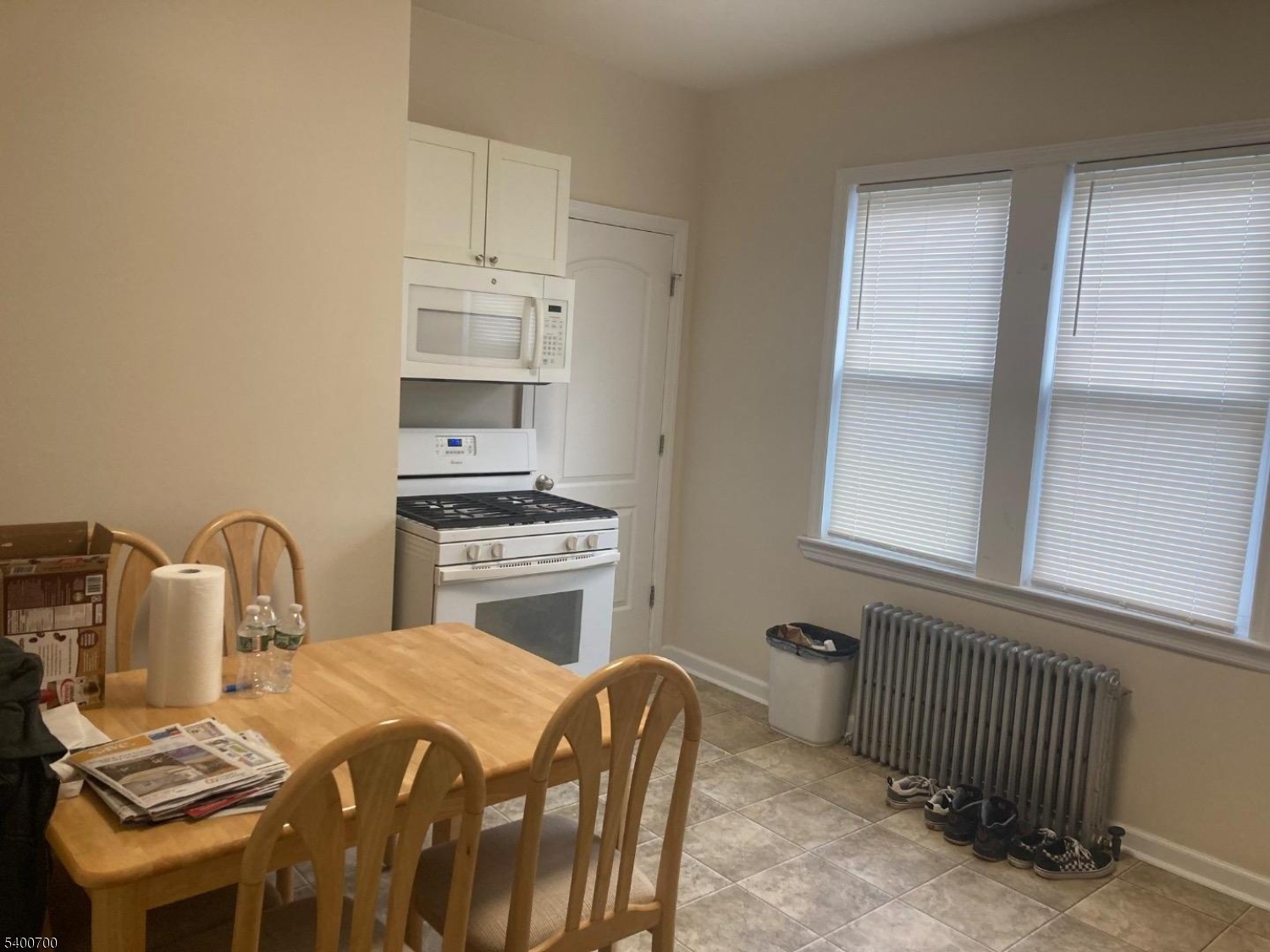 132 Stevens Avenue Little Falls, NJ 07424 - Photo 3 of 8 a bedroom with a bed and a window