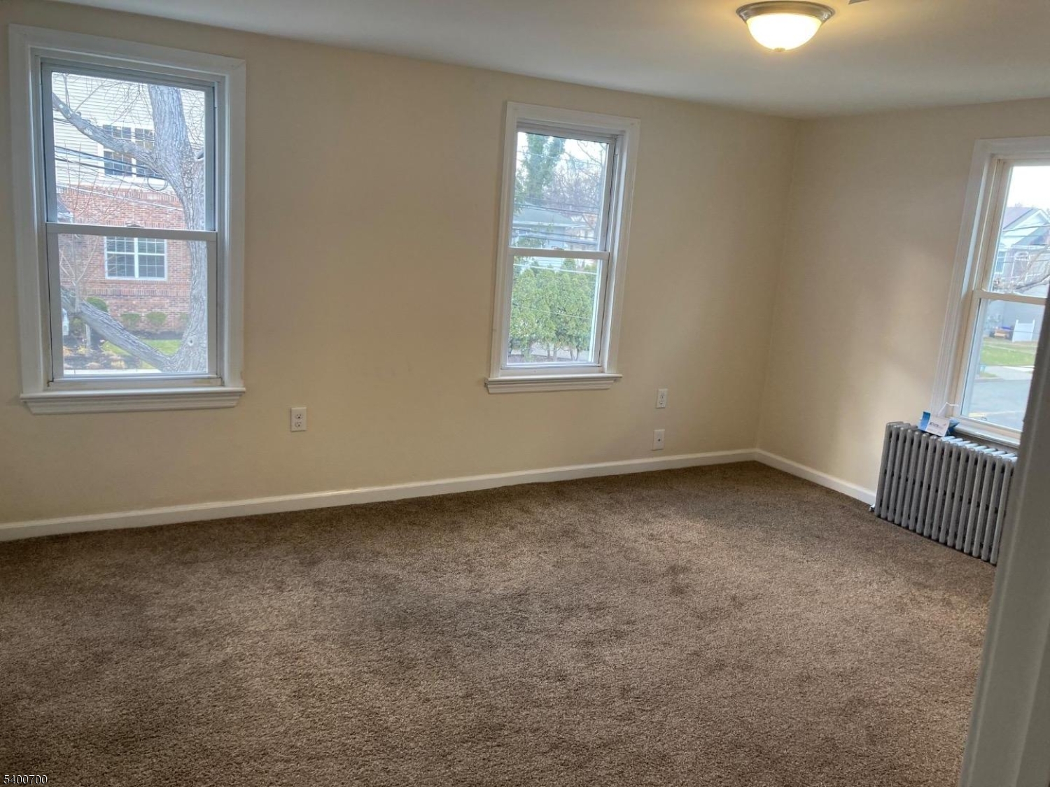 132 Stevens Avenue Little Falls, NJ 07424 - Photo 5 of 8 an empty room with windows