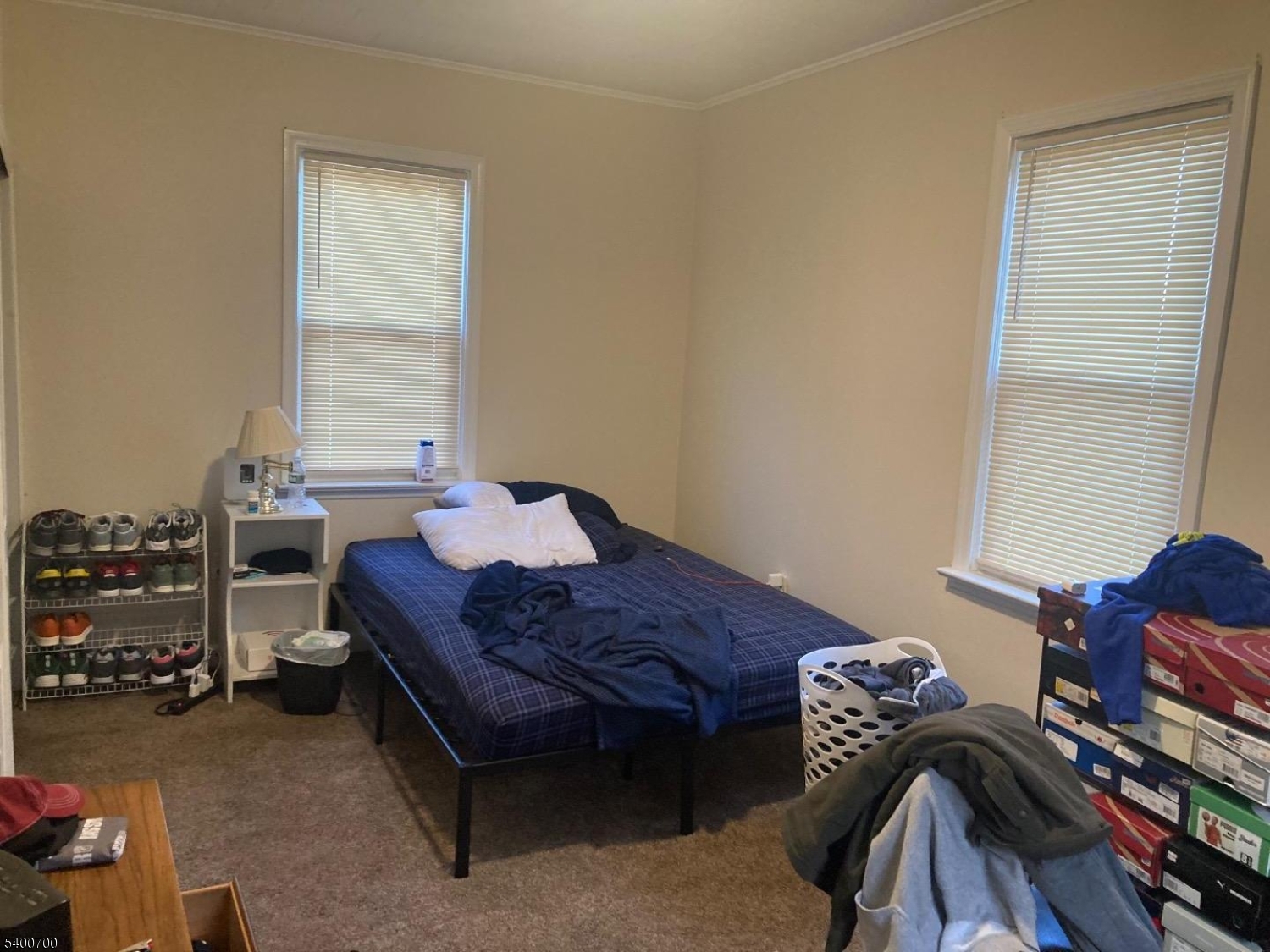 132 Stevens Avenue Little Falls, NJ 07424 - Photo 6 of 8 a bedroom with a bed and a dresser