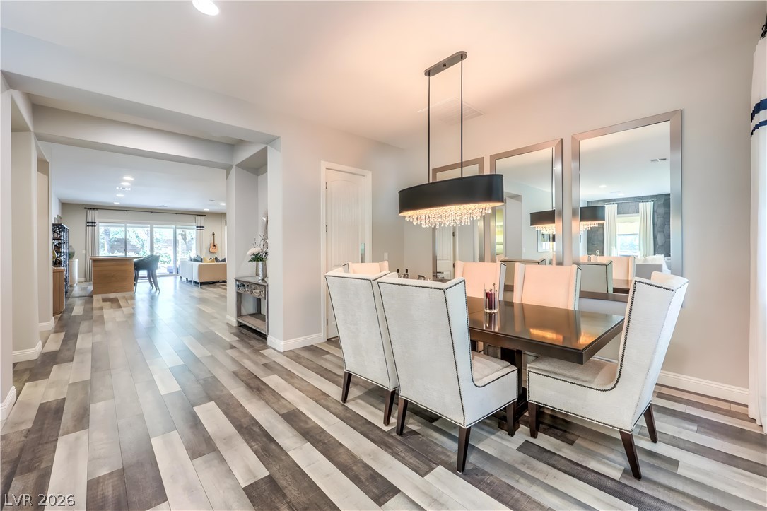 7119 Arabian Ridge Street Las Vegas, NV 89131 - Photo 12 of 73 Elegant dining space, perfect for hosting gatherings, flows seamlessly into the living areas.