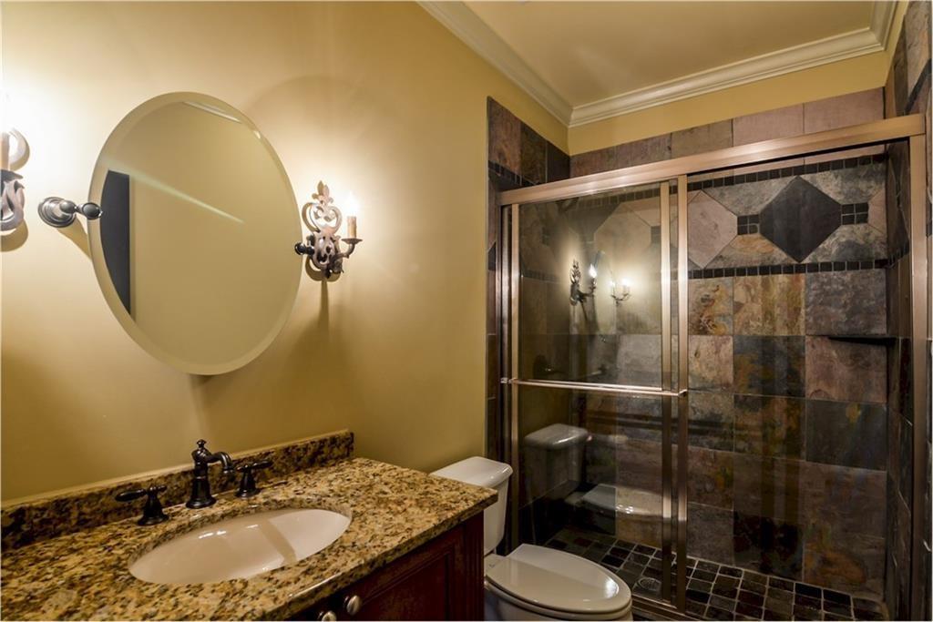 1620 High Trail Southeast Atlanta, GA 30339 - Photo 12 of 17 a bathroom with a granite countertop sink mirror and toilet
