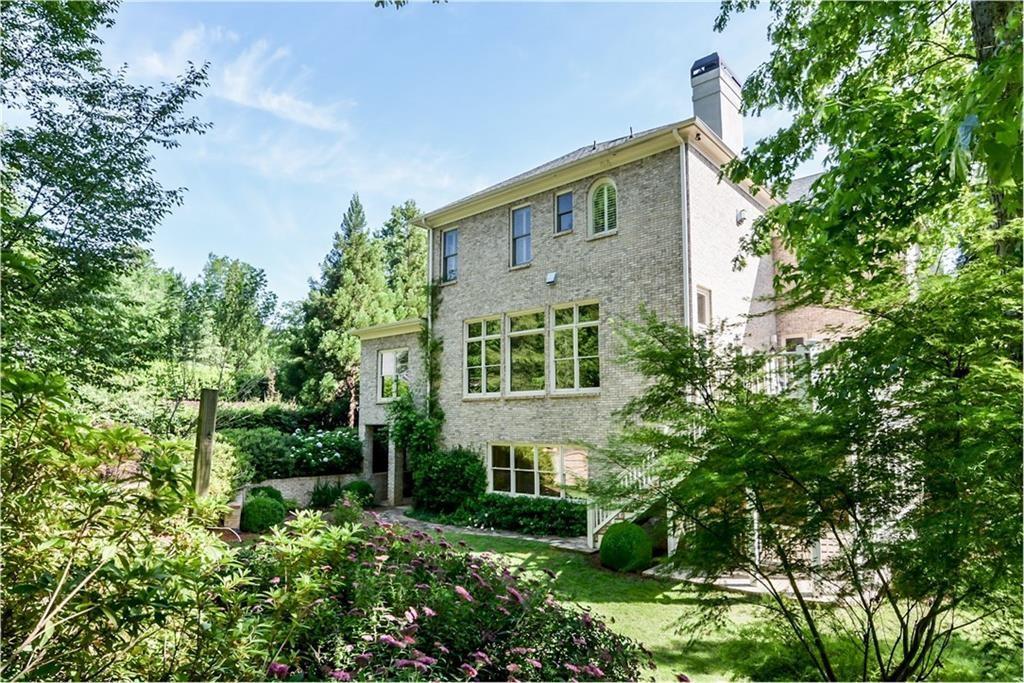 1620 High Trail Southeast Atlanta, GA 30339 - Photo 16 of 17 a view of a brick house next to a yard